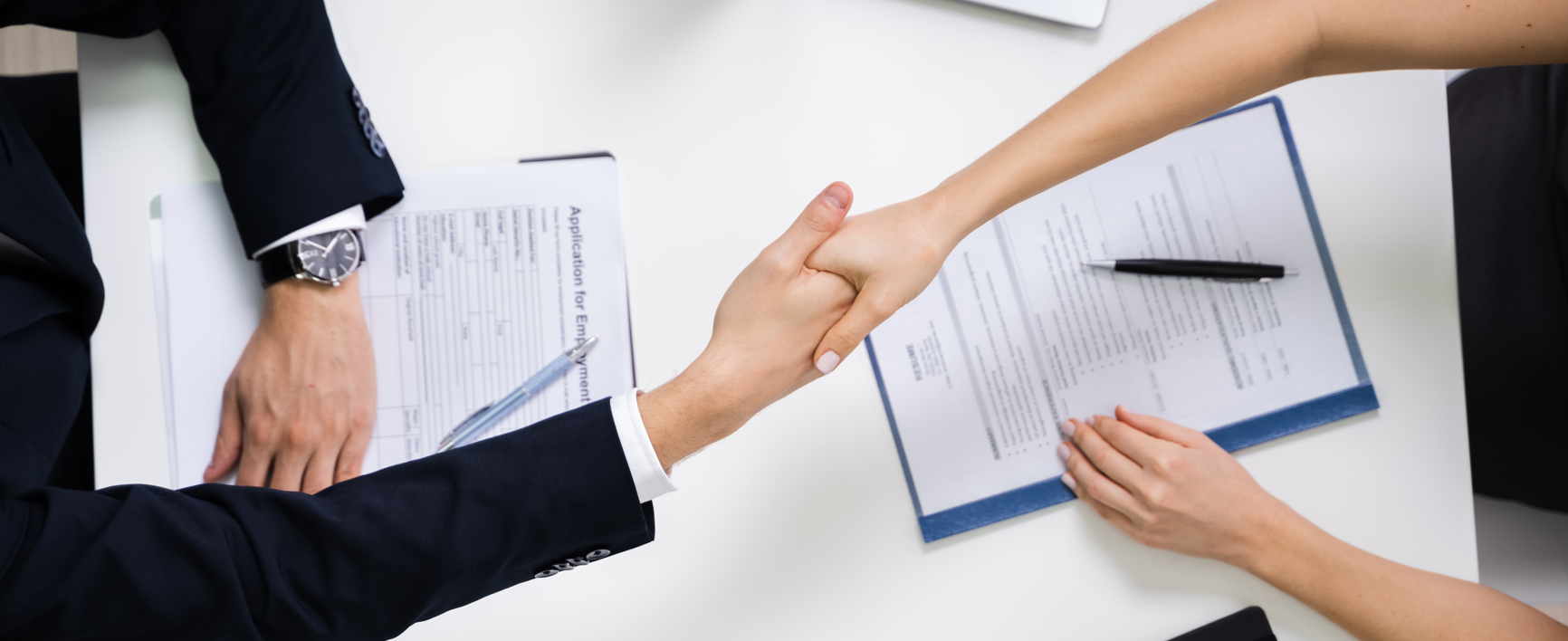 Two Happy Businesswoman Having Handshake